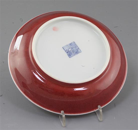 A Chinese sang de boeuf dish, Qianlong mark and probably of the period (1736-1795), diameter 19cm, rim chip